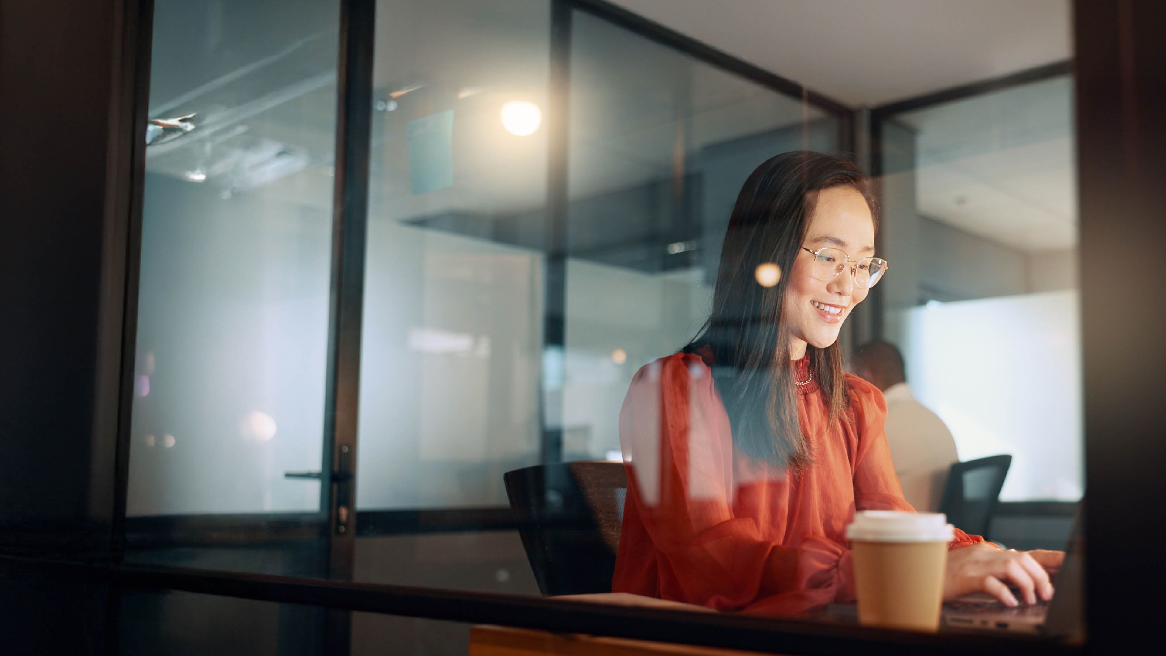Laptop, night office and Asian woman typing email, sales proposal or finishing project deadline. Co.